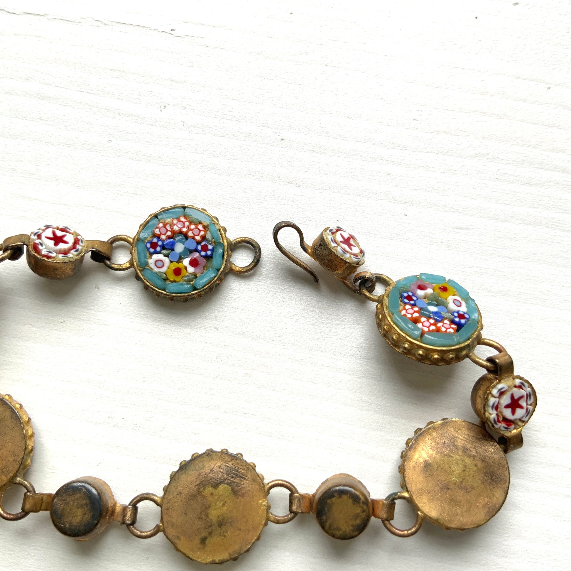 A bracelet featuring colorful floral and star-themed micro-mosaics. カラフルなお花と星のマイクロモザイク のブレスレット。