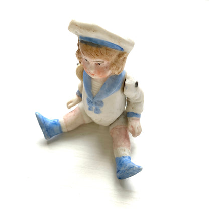 An antique bisque sailor boy doll from around the 1900s–20s. 1900〜20年代頃のセーラーボーイのアンティークビスクドール。 