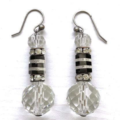 Art Deco vintage earrings featuring large faceted glass beads, striped black and clear glass elements, and sparkling rhinestone-set spacers. アールデコのヴィンテージピアス。