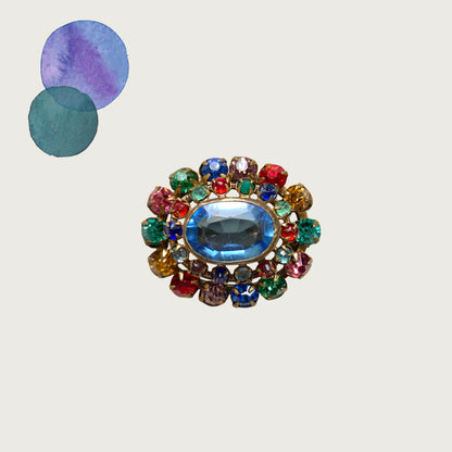 An Art Deco vintage brooch dating to around the 1930s, featuring vibrant multicoloured rhinestones. ビビッドなカラフルラインストーンが輝く、1930年代頃のアールデコヴィンテージブローチ。