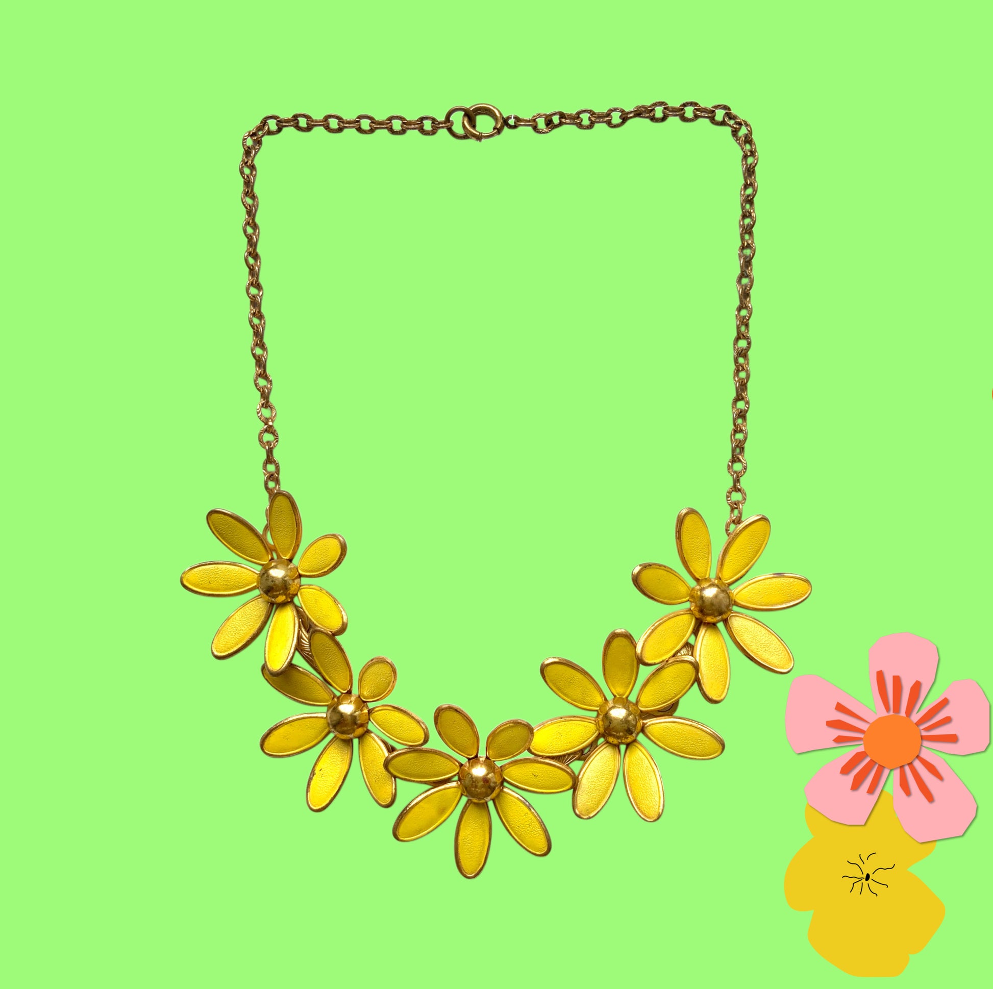 A vintage necklace featuring linked yellow enamel flowers. イエローのエナメルフラワーが連なったヴィンテージネックレス。