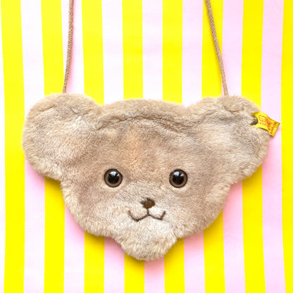A charming Steiff bear-face purse with adorable round eyes and a wonderfully soft, fluffy plush texture.  くりっとした目が愛らしい、クマの顔のポシェット。ふわふわのファー素材で、思わず触りたくなる手触りです。