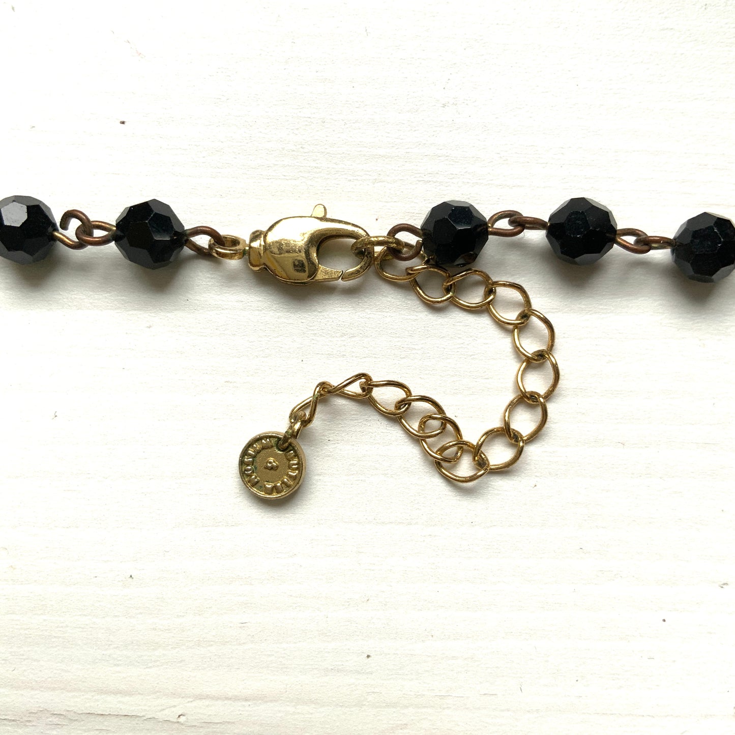 Rosary-style necklace by Butler & Wilson, featuring vivid red lips on a strand of black glass beads.  ブラックグラスビーズに真っ赤な唇をあしらった、バトラー＆ウィルソンのロザリオネックレス。