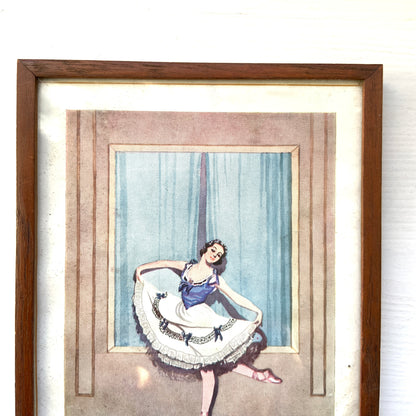 A framed illustration depicting a graceful ballerina. 可憐なバレリーナのイラストが収められたフレーム。