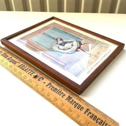 A framed illustration depicting a graceful ballerina. 可憐なバレリーナのイラストが収められたフレーム。