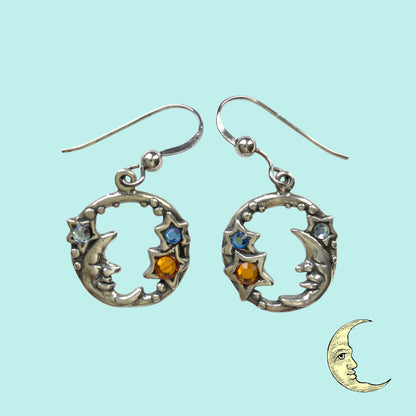 A charming pair of vintage sterling silver earrings by Shube, featuring a gentle smiling moon and star. 穏やかな微笑みをたたえた月と星のShubeのヴィンテージシルバーピアス。 